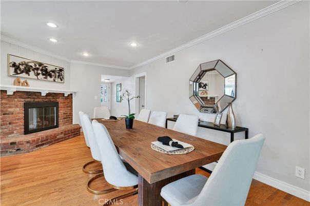 Dining room, Fireplace, Interior, Recessed Lighting, Stone Walls, Wood Texture Flooring