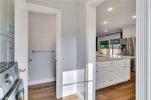 Interior, Kitchen, Recessed Lighting, Stainless Steel Appliances, Washer, Wood Texture Flooring