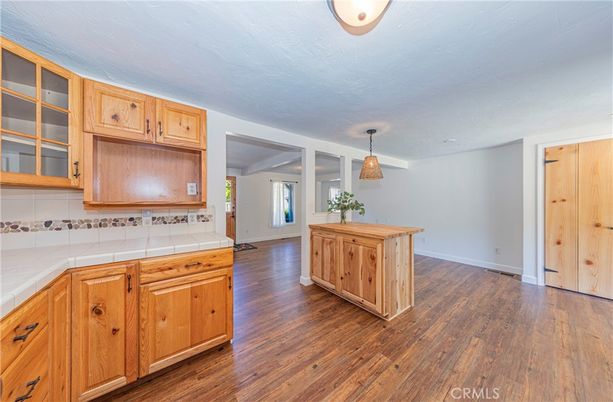 Interior, Kitchen, Pendant Lights, Tile Countertops, Wood Texture Flooring