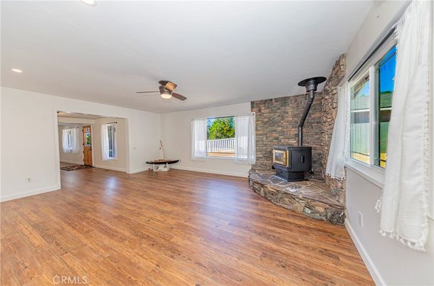Empty room, Fireplace, Interior, Recessed Lighting, Stone Walls, Wood Texture Flooring