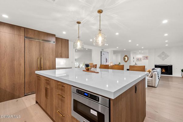 Fireplace, Interior, Kitchen, Pendant Lights, Recessed Lighting, Stainless Steel Appliances, Wood Texture Flooring