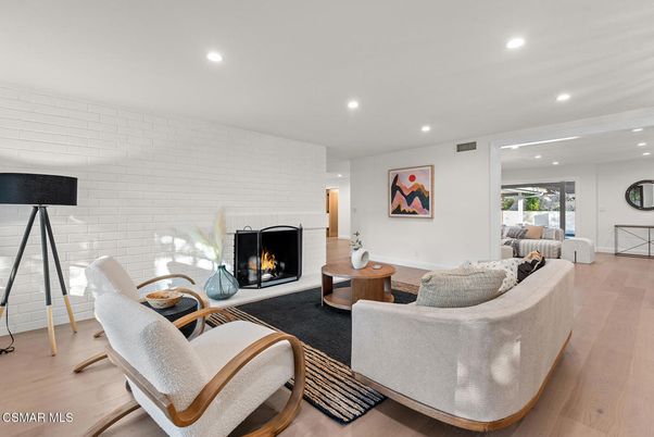 Fireplace, Interior, Living room, Recessed Lighting, Stone Walls, Wood Texture Flooring