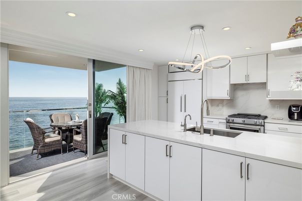 Dining room, Interior, Kitchen, Pendant Lights, Recessed Lighting, Stainless Steel Appliances, Water, Wood Texture Flooring