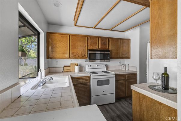 Interior, Kitchen, Tile Countertops, Wood Texture Flooring