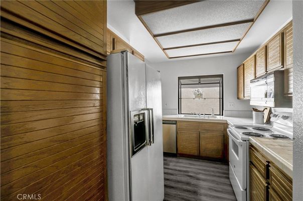 Interior, Kitchen, Stainless Steel Appliances, Tile Countertops, Wood Texture Flooring
