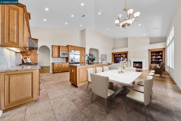 Chandelier, Dining room, Fireplace, Interior, Kitchen, Pendant Lights, Recessed Lighting, Stainless Steel Appliances