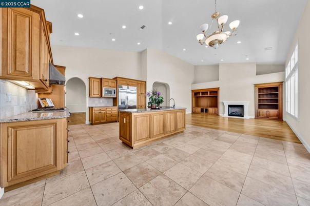 Chandelier, Fireplace, Interior, Kitchen, Recessed Lighting, Wood Texture Flooring