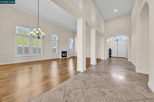 Chandelier, Empty room, Fireplace, Interior, Recessed Lighting, Wood Texture Flooring