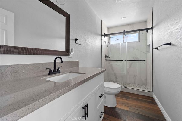 Bathroom, Glass Shower, Interior, Marble Walls, Recessed Lighting, Wood Texture Flooring