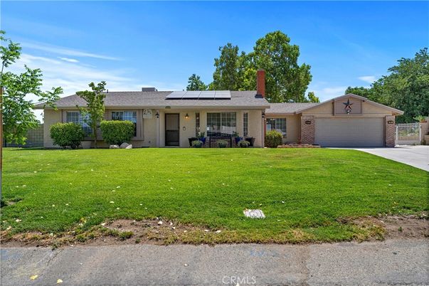 Attached, Backyard, Exterior, Facade, Brick Facade, Solar Panels, Ranch
