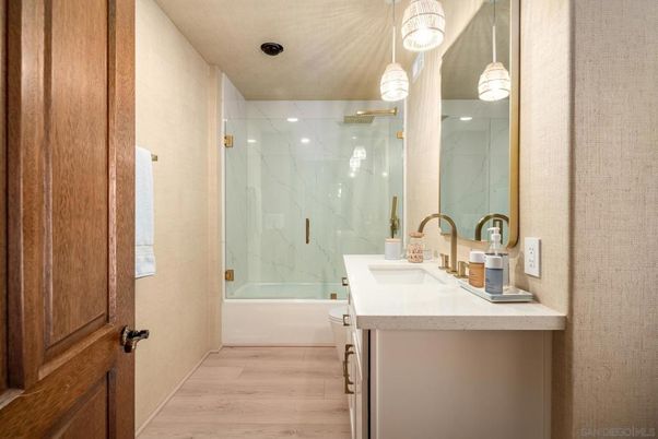 Bathroom, Glass Shower, Interior, Marble Walls, Pendant Lights, Recessed Lighting, Wood Texture Flooring