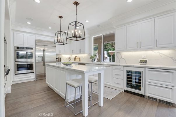 Interior, Kitchen, Marble Walls, Pendant Lights, Recessed Lighting, Stainless Steel Appliances, Wood Texture Flooring