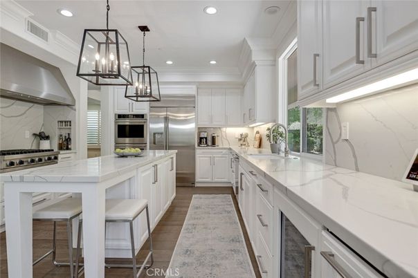 Interior, Kitchen, Marble Walls, Pendant Lights, Recessed Lighting, Stainless Steel Appliances, Wood Texture Flooring