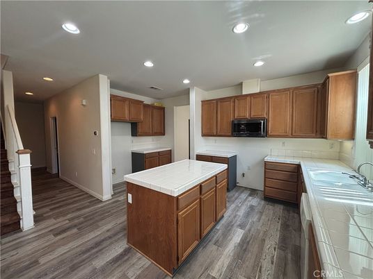 Interior, Kitchen, Recessed Lighting, Tile Countertops, Wood Texture Flooring