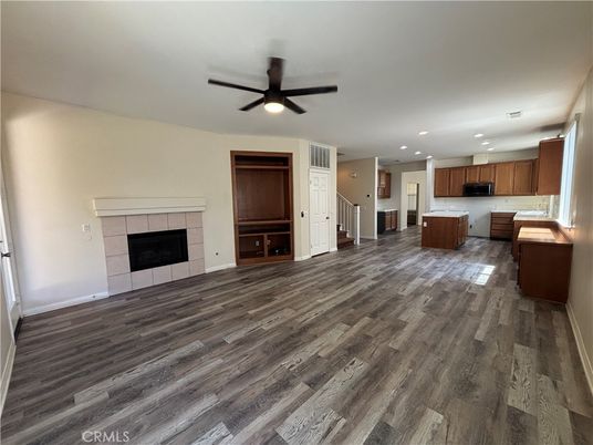 Empty room, Fireplace, Interior, Kitchen, Recessed Lighting, Wood Texture Flooring