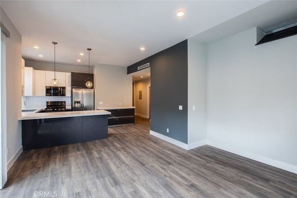 Interior, Kitchen, Pendant Lights, Recessed Lighting, Stainless Steel Appliances, Wood Texture Flooring