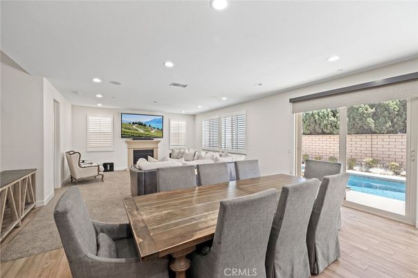 Dining room, Fireplace, Interior, Living room, Recessed Lighting, Wood Texture Flooring
