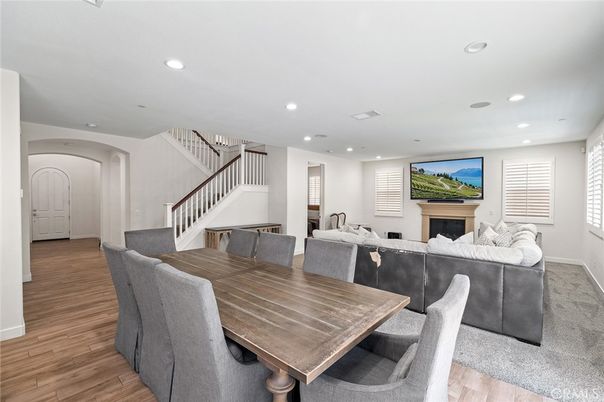 Dining room, Fireplace, Interior, Living room, Recessed Lighting, Wood Texture Flooring