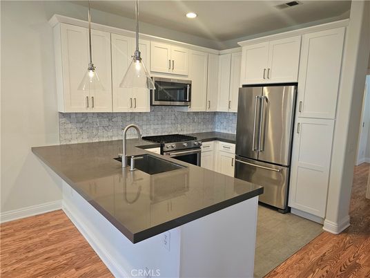 Interior, Kitchen, Pendant Lights, Recessed Lighting, Stainless Steel Appliances, Wood Texture Flooring
