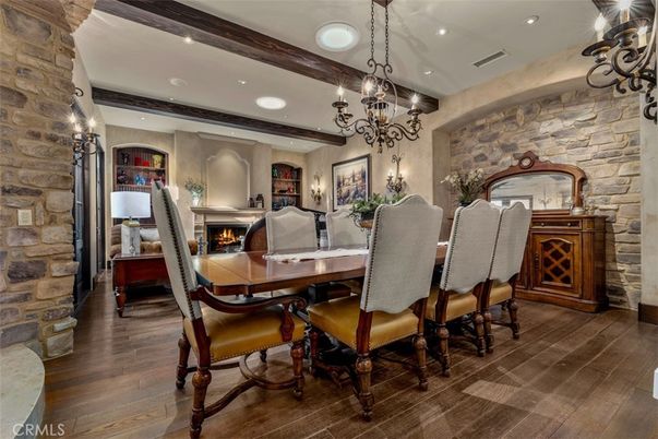 Chandelier, Dining room, Fireplace, Interior, Recessed Lighting, Stone Walls, Wooden Beams, Wood Texture Flooring
