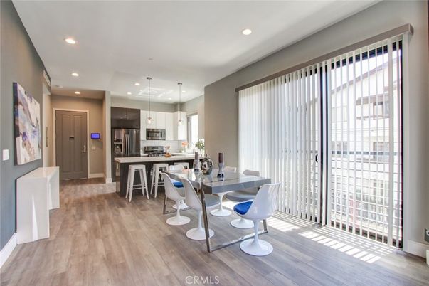 Dining room, Interior, Kitchen, Pendant Lights, Recessed Lighting, Stainless Steel Appliances, Wood Texture Flooring