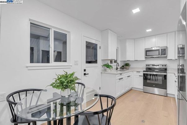 Dining room, Interior, Kitchen, Recessed Lighting, Stainless Steel Appliances, Wood Texture Flooring