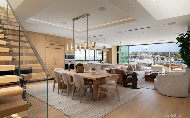 Dining room, Interior, Living room, Pendant Lights, Recessed Lighting, Stainless Steel Appliances, Wood Texture Flooring