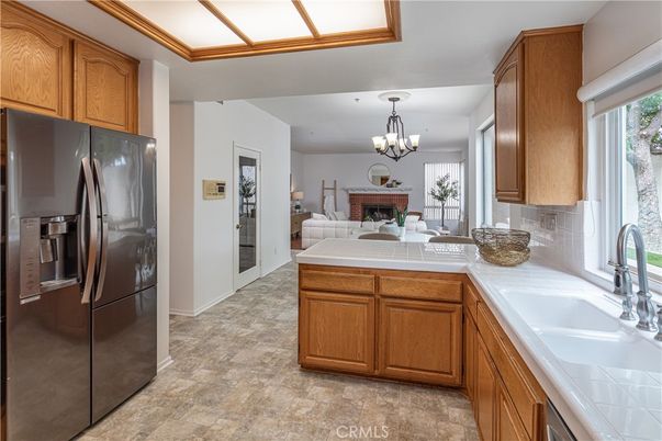 Chandelier, Dining room, Fireplace, Interior, Kitchen, Tile Countertops