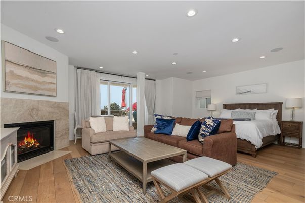 Bedroom, Fireplace, Interior, Living room, Recessed Lighting, Wood Texture Flooring