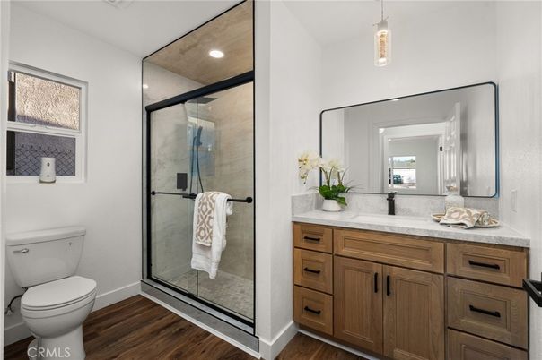 Bathroom, Glass Shower, Interior, Pendant Lights, Recessed Lighting, Wood Texture Flooring