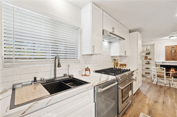 Fireplace, Interior, Kitchen, Recessed Lighting, Wood Texture Flooring