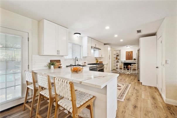 Dining room, Interior, Kitchen, Recessed Lighting, Stainless Steel Appliances, Wood Texture Flooring