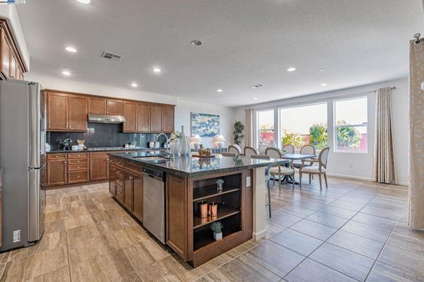 Dining room, Interior, Kitchen, Recessed Lighting, Stainless Steel Appliances, Wood Texture Flooring