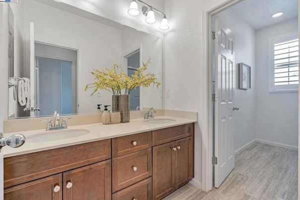 Bathroom, Dual Sink Vanities, Interior, Recessed Lighting, Wood Texture Flooring