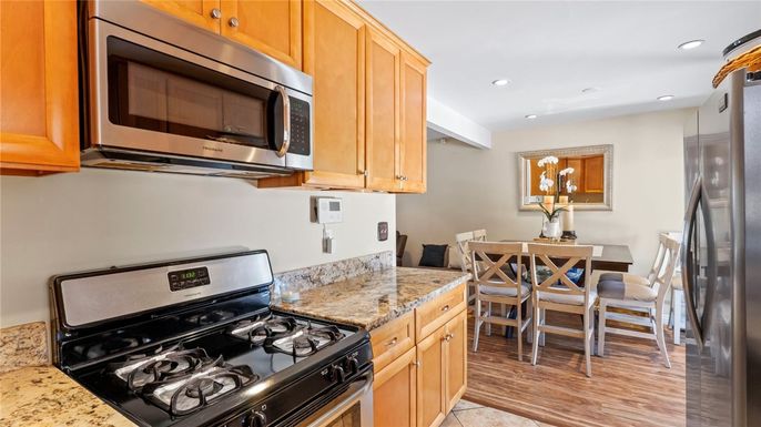 Dining room, Interior, Kitchen, Recessed Lighting, Stainless Steel Appliances, Wood Texture Flooring