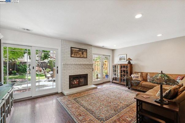 Fireplace, Interior, Living room, Recessed Lighting, Stone Walls, Wood Texture Flooring