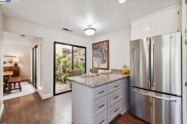 Dining room, Interior, Kitchen, Recessed Lighting, Stainless Steel Appliances, Wood Texture Flooring