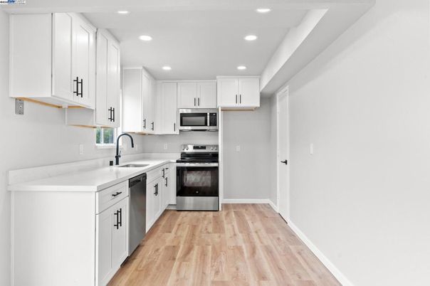Interior, Kitchen, Recessed Lighting, Stainless Steel Appliances, Wood Texture Flooring