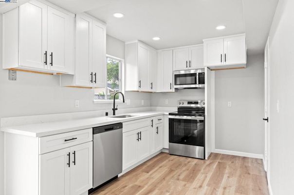 Interior, Kitchen, Recessed Lighting, Stainless Steel Appliances, Wood Texture Flooring