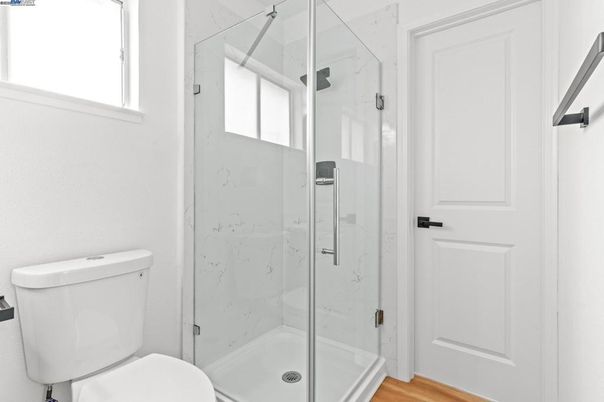 Bathroom, Glass Shower, Interior, Marble Walls, Wood Texture Flooring