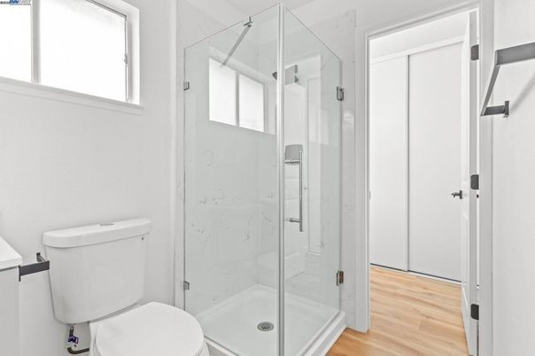 Bathroom, Glass Shower, Interior, Marble Walls, Wood Texture Flooring