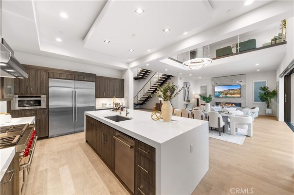 Dining room, Fireplace, Interior, Kitchen, Living room, Pendant Lights, Recessed Lighting, Stainless Steel Appliances, Wood Texture Flooring