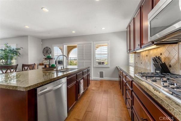 Dining room, Interior, Kitchen, Recessed Lighting, Stainless Steel Appliances, Wood Texture Flooring