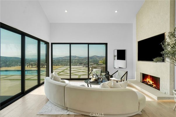 Fireplace, Interior, Living room, Recessed Lighting, Water, Wood Texture Flooring