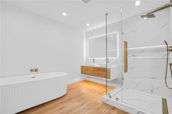 Bathroom, Glass Shower, Interior, Marble Walls, Recessed Lighting, Wood Texture Flooring