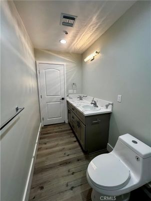 Bathroom, Dual Sink Vanities, Interior, Recessed Lighting, Wood Texture Flooring