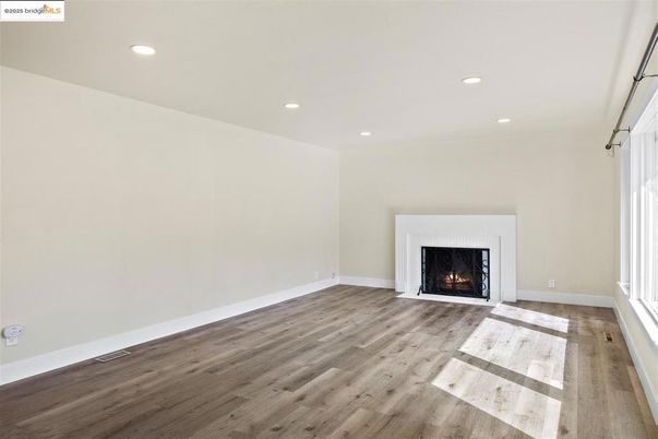 Empty room, Fireplace, Interior, Recessed Lighting, Wood Texture Flooring