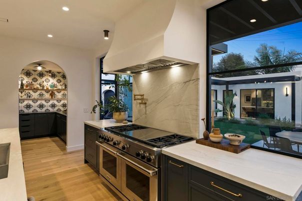 Interior, Kitchen, Marble Walls, Recessed Lighting, Stainless Steel Appliances, Wood Texture Flooring