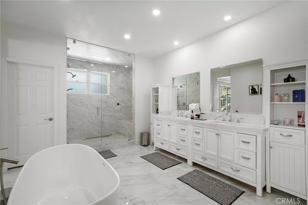 Bathroom, Dual Sink Vanities, Free Standing Baths, Glass Shower, Interior, Marble, Marble Walls, Recessed Lighting
