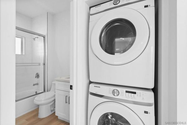 Bathroom, Glass Shower, Interior, Utility Closets, Washer, Wood Texture Flooring